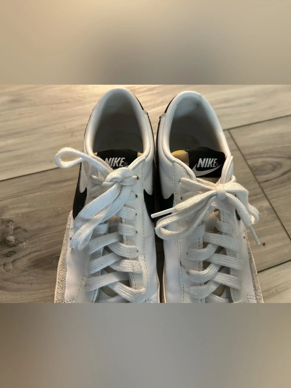 Nike White and Black Low-Top Sneakers with Yellow Tongue Accent